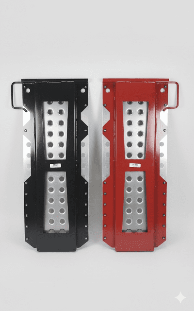 Black and red car hauler loading ramps with perforated traction plates and side handles